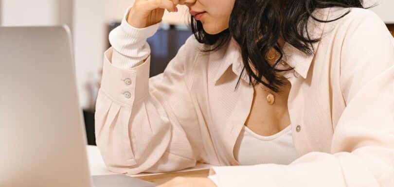 Adult struggling to focus at a desk representing adult ADHD treatment in Miami