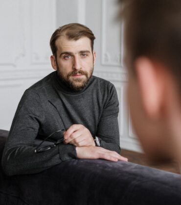 Person reflecting on the difference between anxiety and depression in Miami