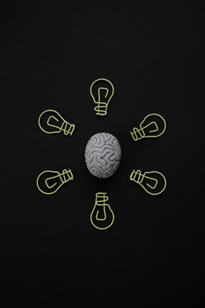 Brain illustration comparing BrainsWay Deep TMS and NeuroStar technology in Miami