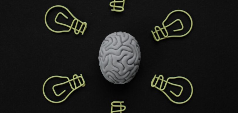 Brain illustration comparing BrainsWay Deep TMS and NeuroStar technology in Miami