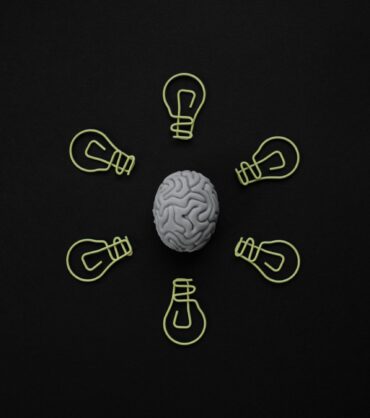 Brain illustration comparing BrainsWay Deep TMS and NeuroStar technology in Miami