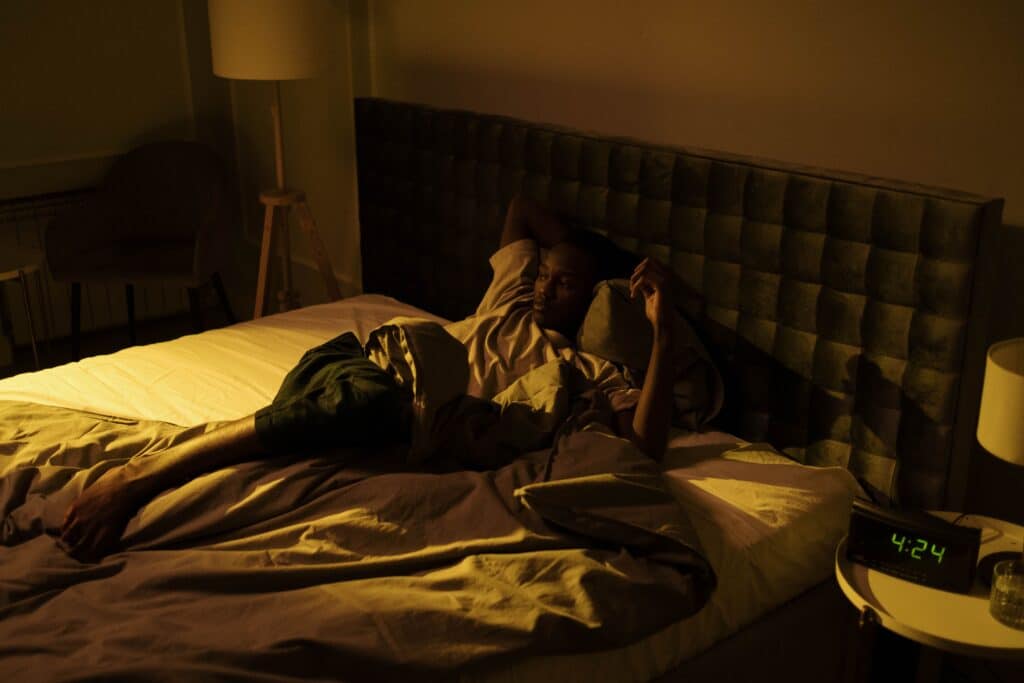 Person awake at night representing insomnia and depression treatment in Miami