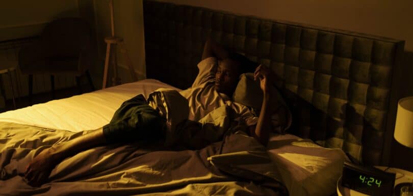 Person awake at night representing insomnia and depression treatment in Miami