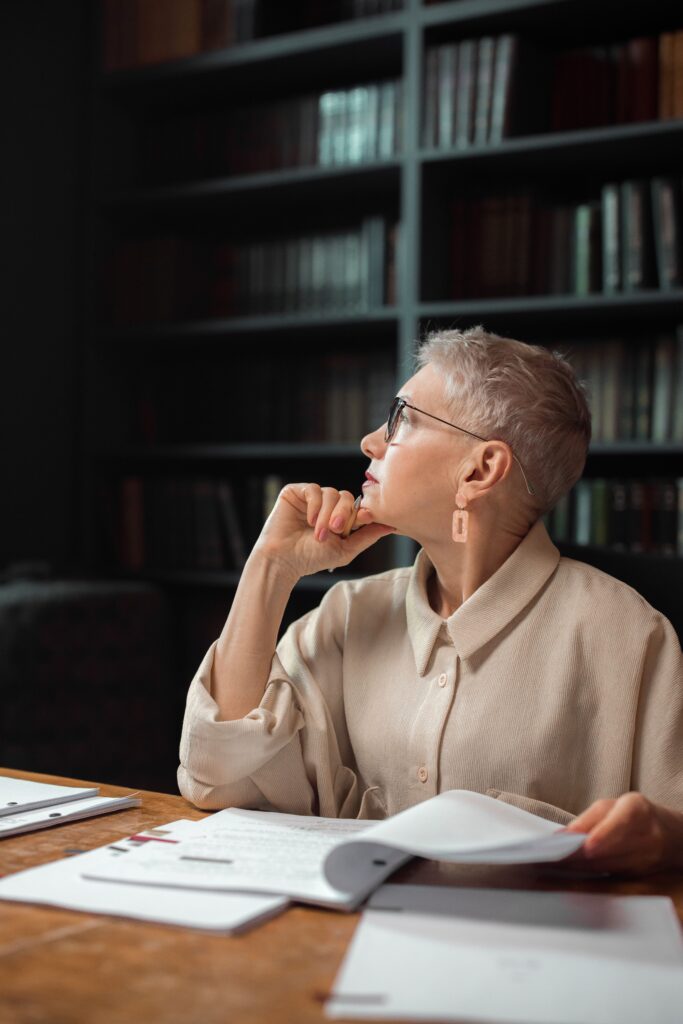 Woman reflecting, representing menopause and mental health care in Miami