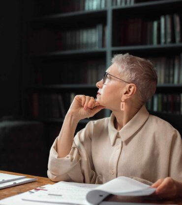 Woman reflecting, representing menopause and mental health care in Miami